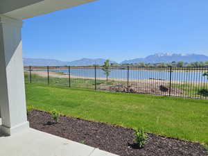 View of yard featuring a water and mountain view