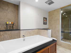 Primary bedroom bath with sep tub and shower