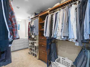 Spacious closet featuring built-ins in primary bedroom