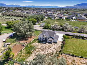 Aerial perspective of suburban area featuring a mountainous background