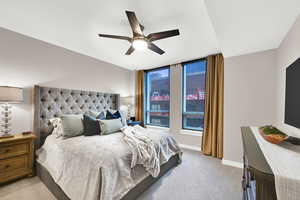 Bedroom featuring carpet flooring, ceiling fan, and baseboards