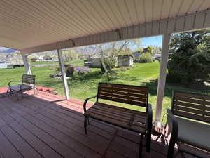 Wooden deck featuring a yard