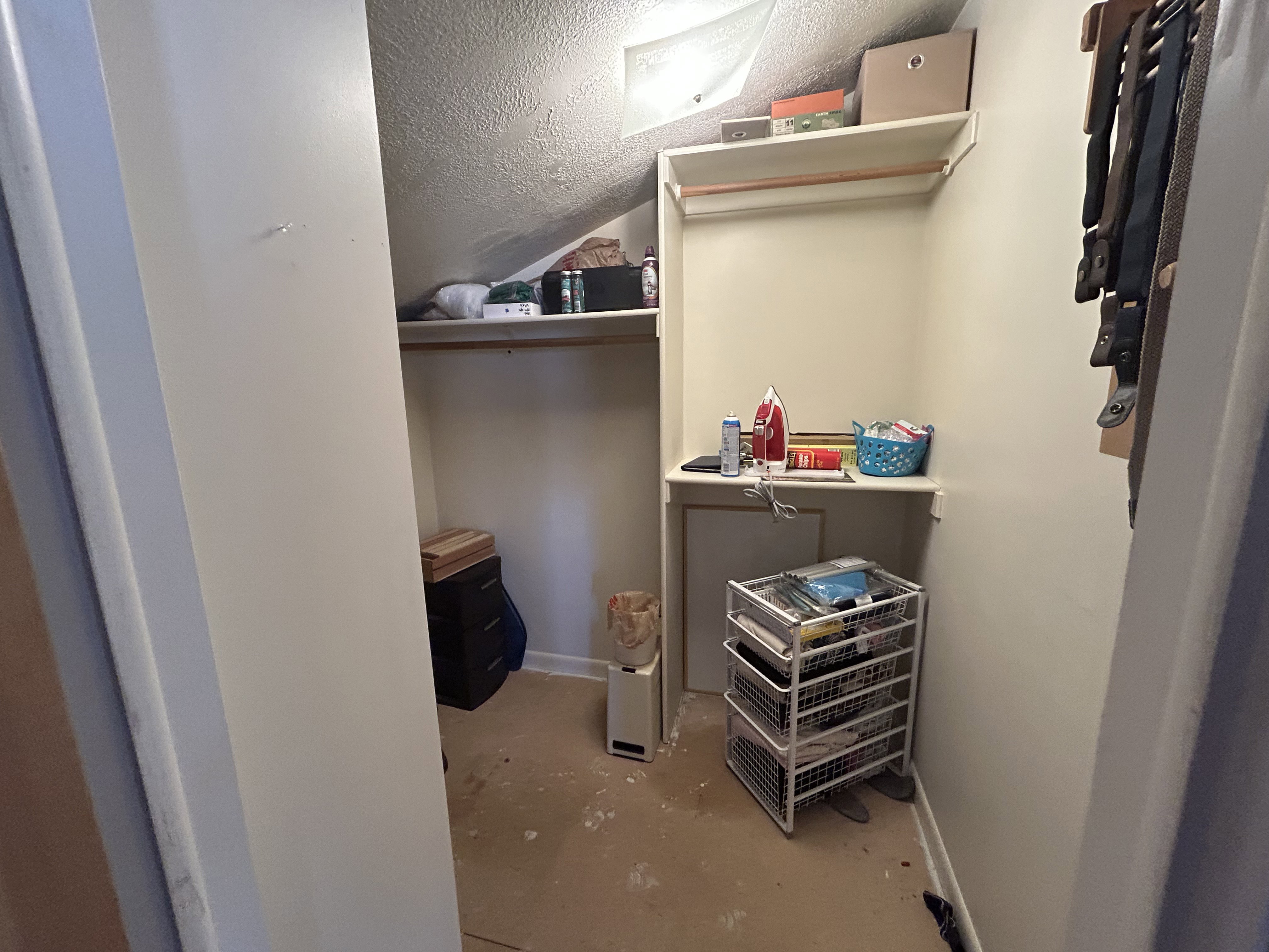 Walk in closet featuring vaulted ceiling