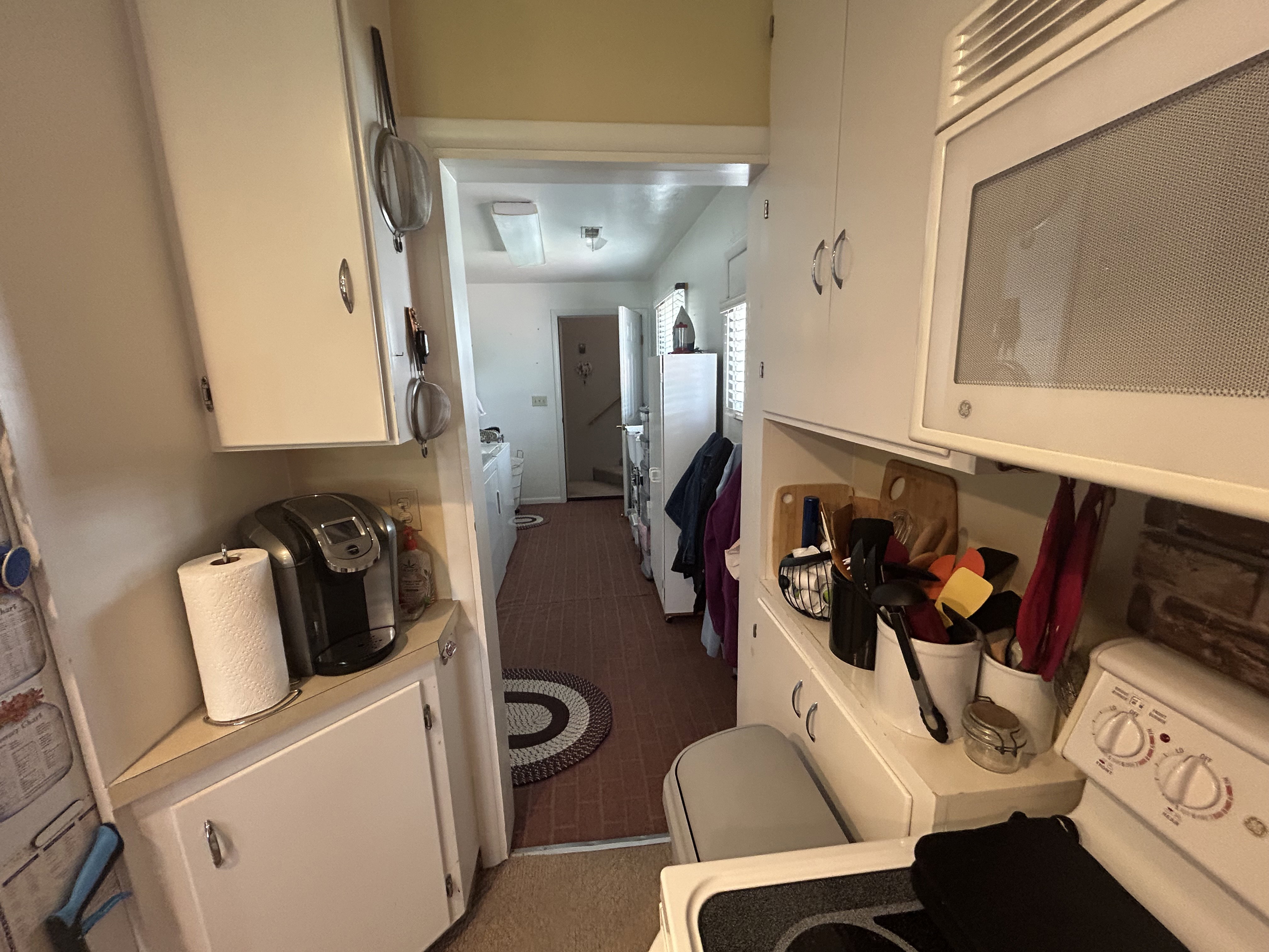 Bathroom with washer / dryer and tile patterned flooring