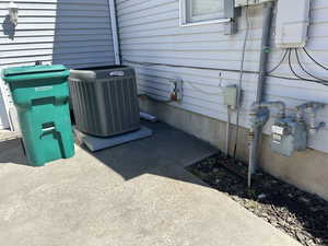 Exterior view of central AC unit and gas meter