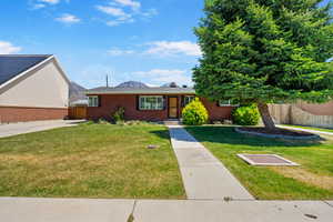 View of front of house with brick siding