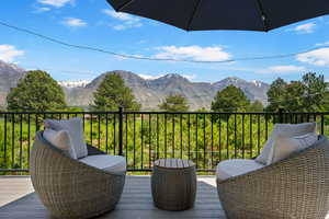 Wooden terrace featuring a mountain view