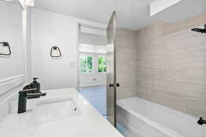 Bathroom featuring a textured ceiling and vanity