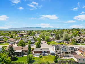 Aerial view of residential area featuring a mountain backdrop