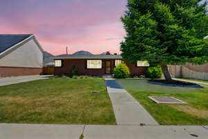 Ranch-style house featuring brick siding