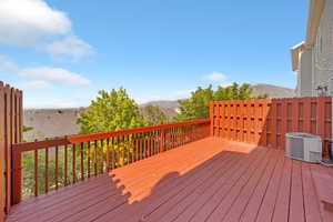 Deck featuring mountain and valley views