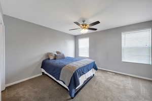 Primary bedroom with ceiling fan