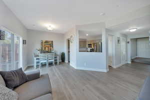 Living room with light wood laminate flooring