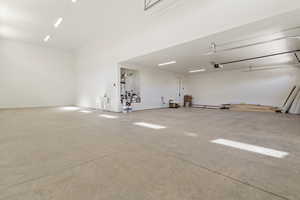 Garage featuring a garage door opener