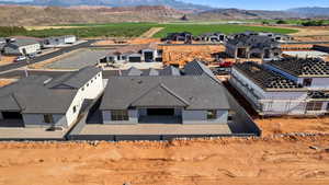 Aerial perspective of suburban area featuring a mountain backdrop