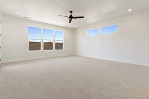 Empty room with recessed lighting, ceiling fan, baseboards, and light colored carpet