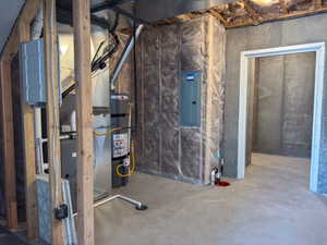 Unfinished basement with electric panel