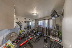 Workout area with a textured ceiling
