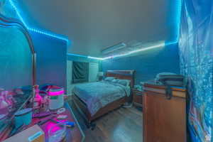 Bedroom with wood finished floors