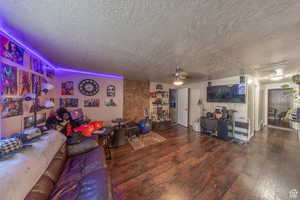 Living room featuring wood finished floors and a textured ceiling