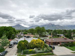 View of mountain background featuring nearby suburban area