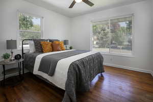 Bedroom with hardwood floors, baseboards, and a ceiling fan