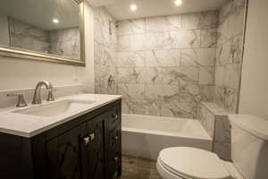 Full bath featuring toilet, shower / bath combination, recessed lighting, and vanity