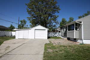 Detached garage with concrete driveway
