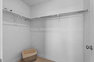 Walk in closet for main floor primary bedroom