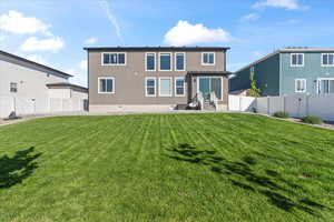 Rear view of house with stucco siding