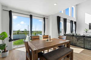 Dining area featuring light wood-style floors and recessed lighting