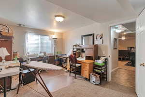Office featuring light colored carpet and light tile patterned flooring