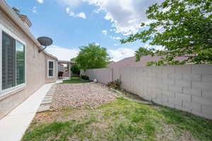 Fenced backyard featuring a patio area