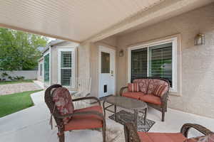 View of patio featuring fence