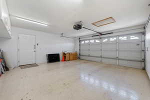 Garage featuring a garage door opener