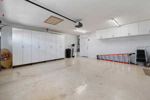Garage featuring a garage door opener