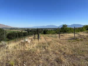 View of mountain backdrop with rural landscape