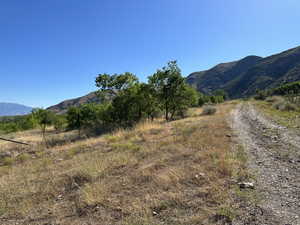 View of mountain backdrop with rural landscape