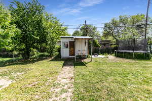 View of shed featuring a trampoline