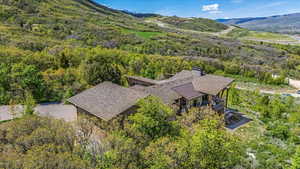 View from above of property featuring a forest