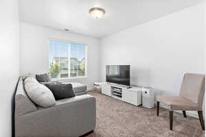 Living room with carpet and baseboards