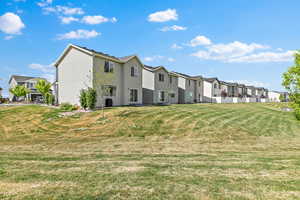 View of community with a residential view and a yard