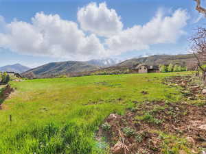 View of mountain backdrop featuring rural landscape