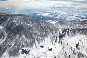 Snowy aerial view with a mountain view