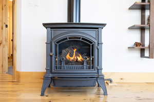 Detailed view of a wood stove and wood finished floors