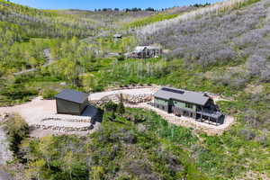 View of subject property featuring a heavily wooded area