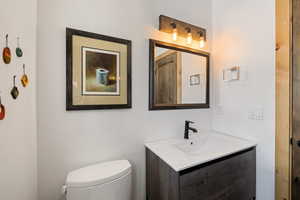Half bath with toilet and vanity