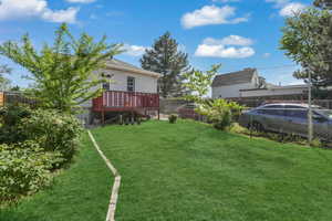 View of yard with a deck