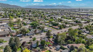 Aerial perspective of suburban area featuring a mountainous background