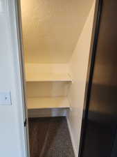 Detailed view of carpet floors and baseboards